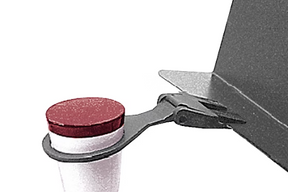 A black and red Manhasset trombone mute holder designed to clip onto the lip of a music stand.