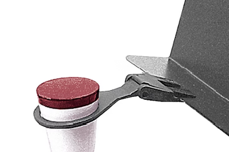 A black and red Manhasset trombone mute holder designed to clip onto the lip of a music stand.
