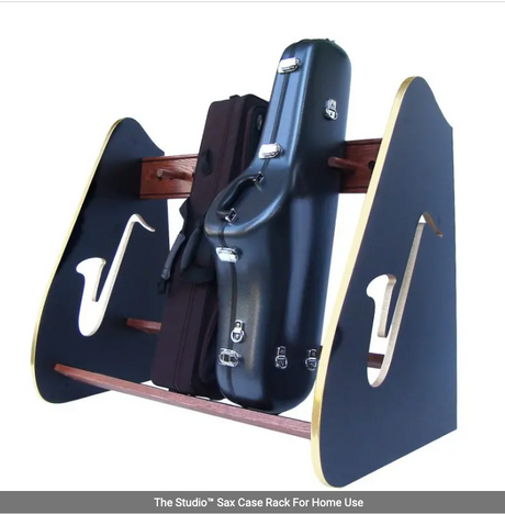 Saxophone case on a stand with 'The Studio' branding