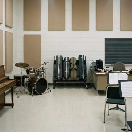 Music classroom with musical instruments including a drum set, piano, and various percussion instruments.