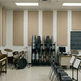 Music classroom with musical instruments, chairs, and a piano.