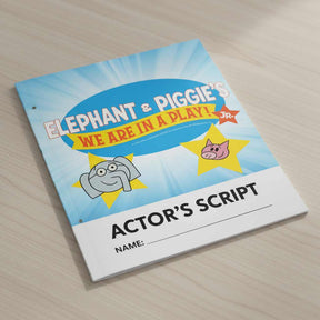 Actor's script for 'Elephant & Piggie's We Are in a Play! Jr.' on a wooden surface