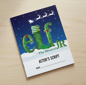 Actor's script for 'Elf Jr. The Musical' on a wooden surface