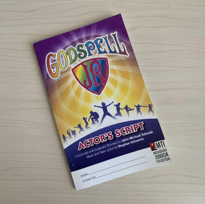 GOSPELL JR. Actor's Script book on a wooden surface