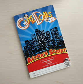 Book titled 'Gypsy Dolls Jr. Actor's Script' on a wooden surface