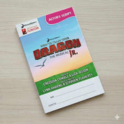 Actor's script for 'How to Train Your Dragon Jr.' on a wooden surface