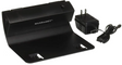 Manhasset Trente LED Music Stand Lamp, black in color, with an adjustable arm and a rectangular base, accompanied by a power plug.