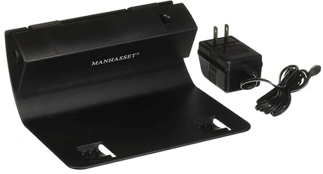 Manhasset Trente LED Music Stand Lamp, black in color, with an adjustable arm and a rectangular base, accompanied by a power plug.