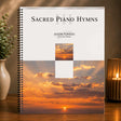 Music book titled 'Sacred Piano Hymns III' by Jason Tonioli with sunset design on cover, placed on a wooden surface.