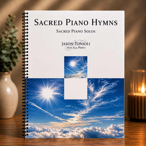 Music book titled 'Sacred Piano Hymns' by Jason Tonioli on a wooden surface with a decorative background.